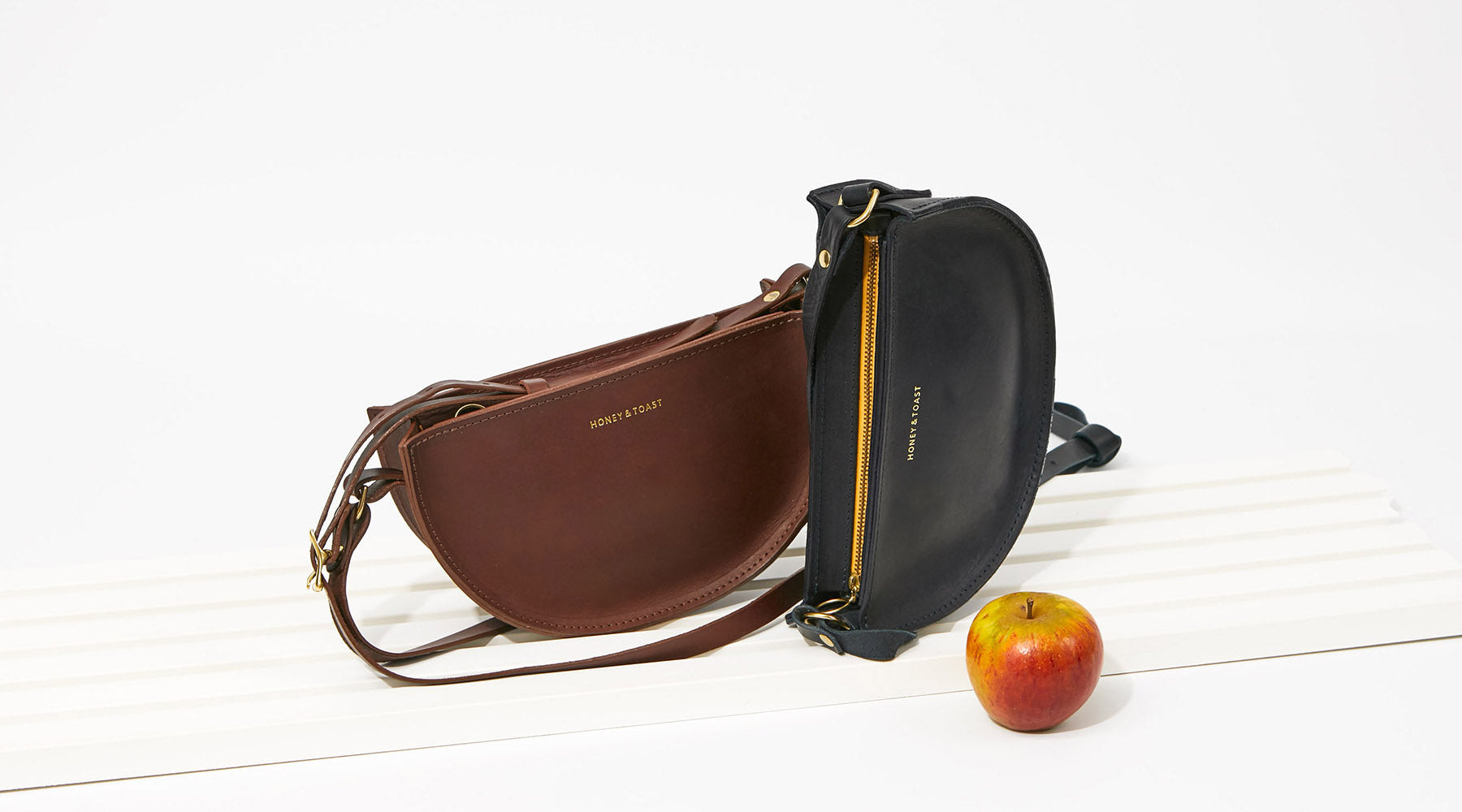 Honey and Toast leather half moon bag in conker and black