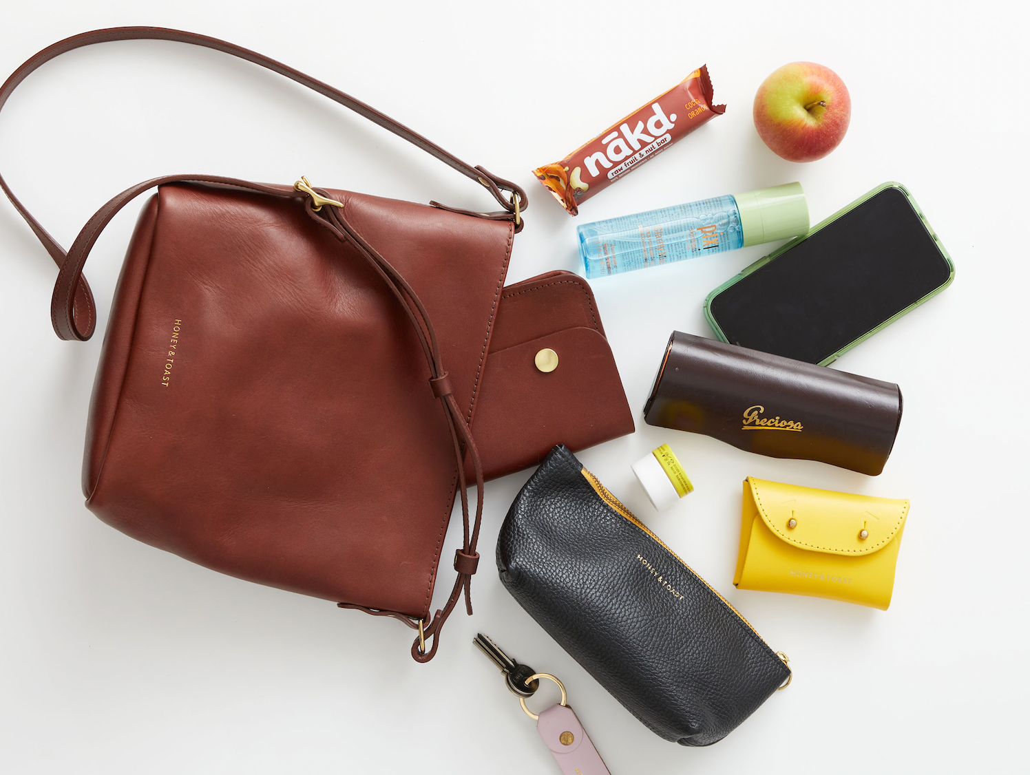 Honey and Toast conker leather Mini Libby bag and the contents