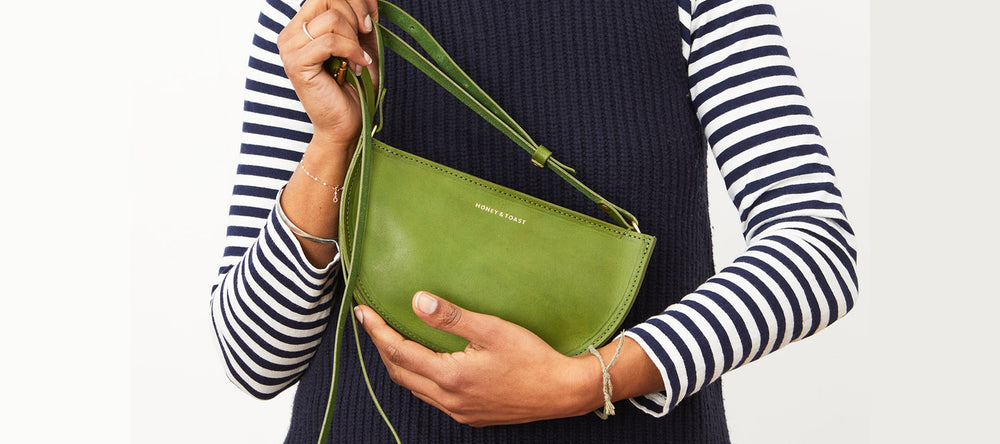 Green leather half moon shaped handbag