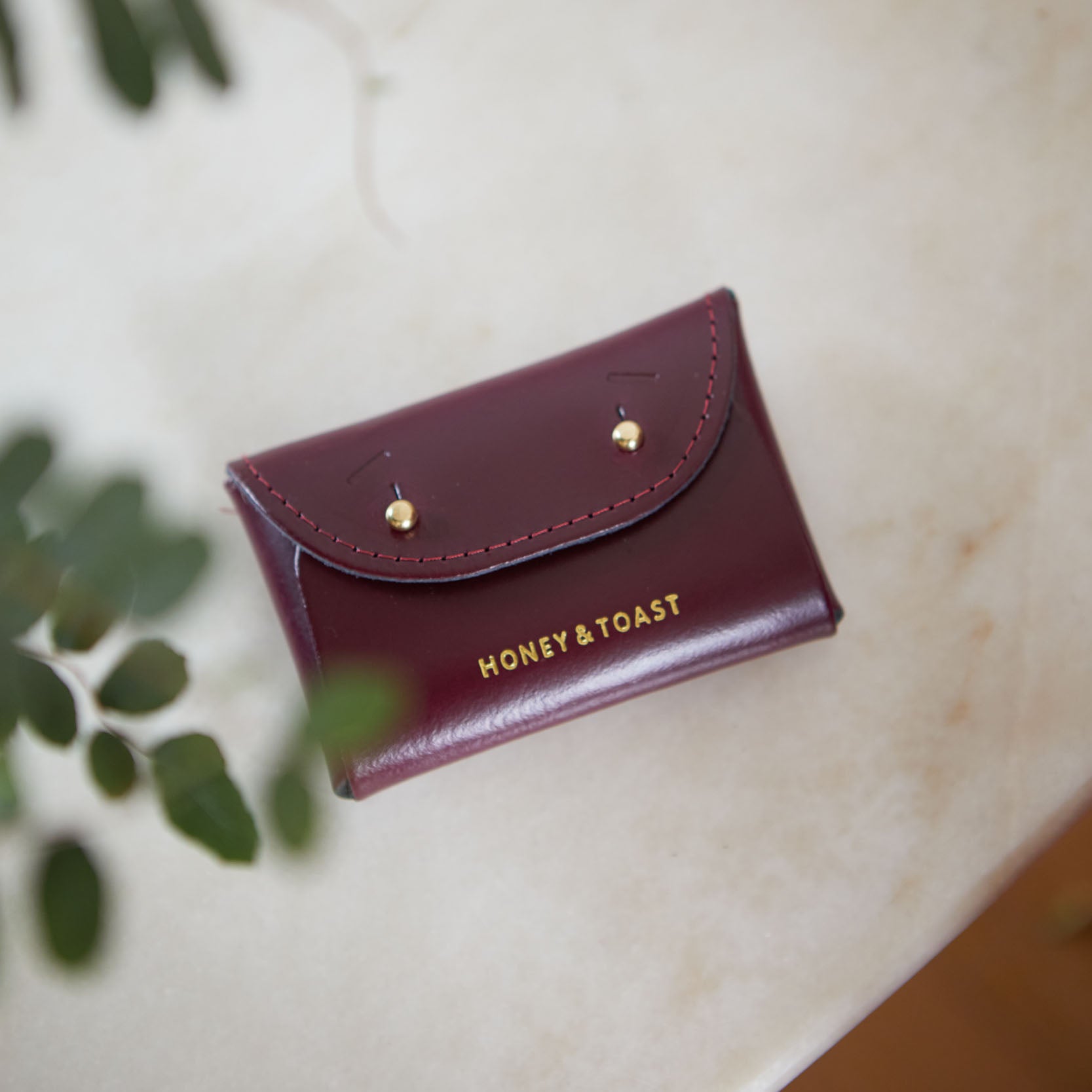 https://www.honeyandtoast.co.uk women's leather purse Jester card holder damson