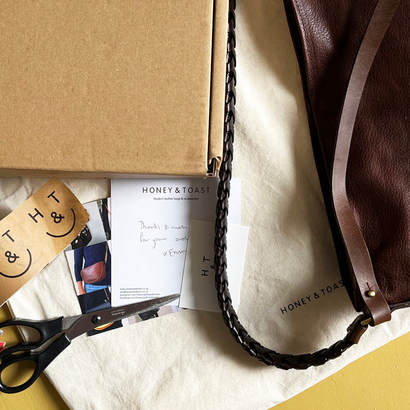 Honey and Toast leather handbag being packed