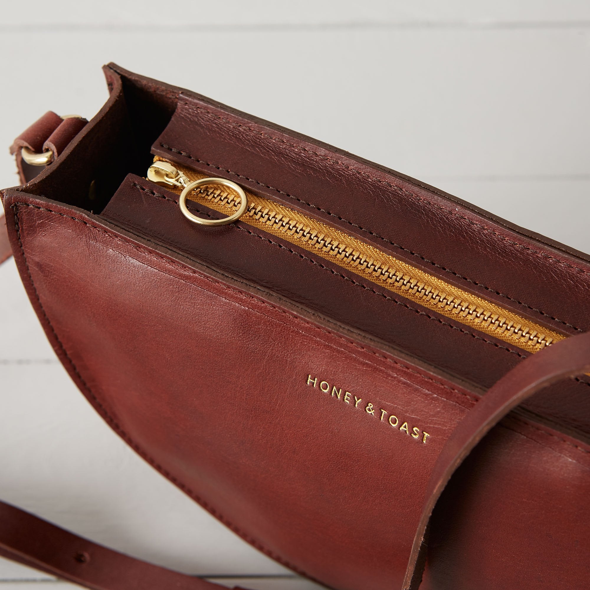 https://www.honeyandtoast.co.uk Half moon bag conker