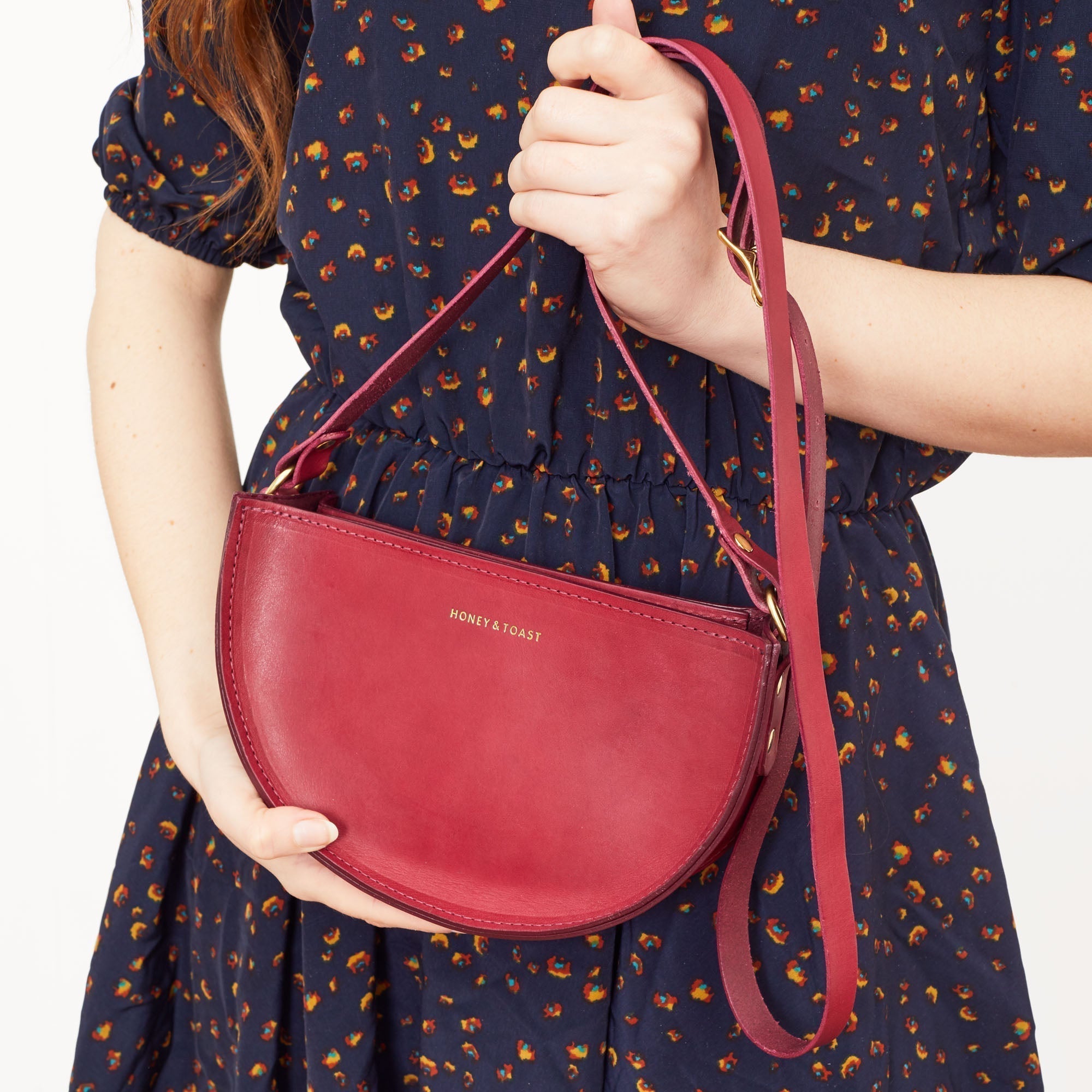 https://www.honeyandtoast.co.uk Half moon bag raspberry pink