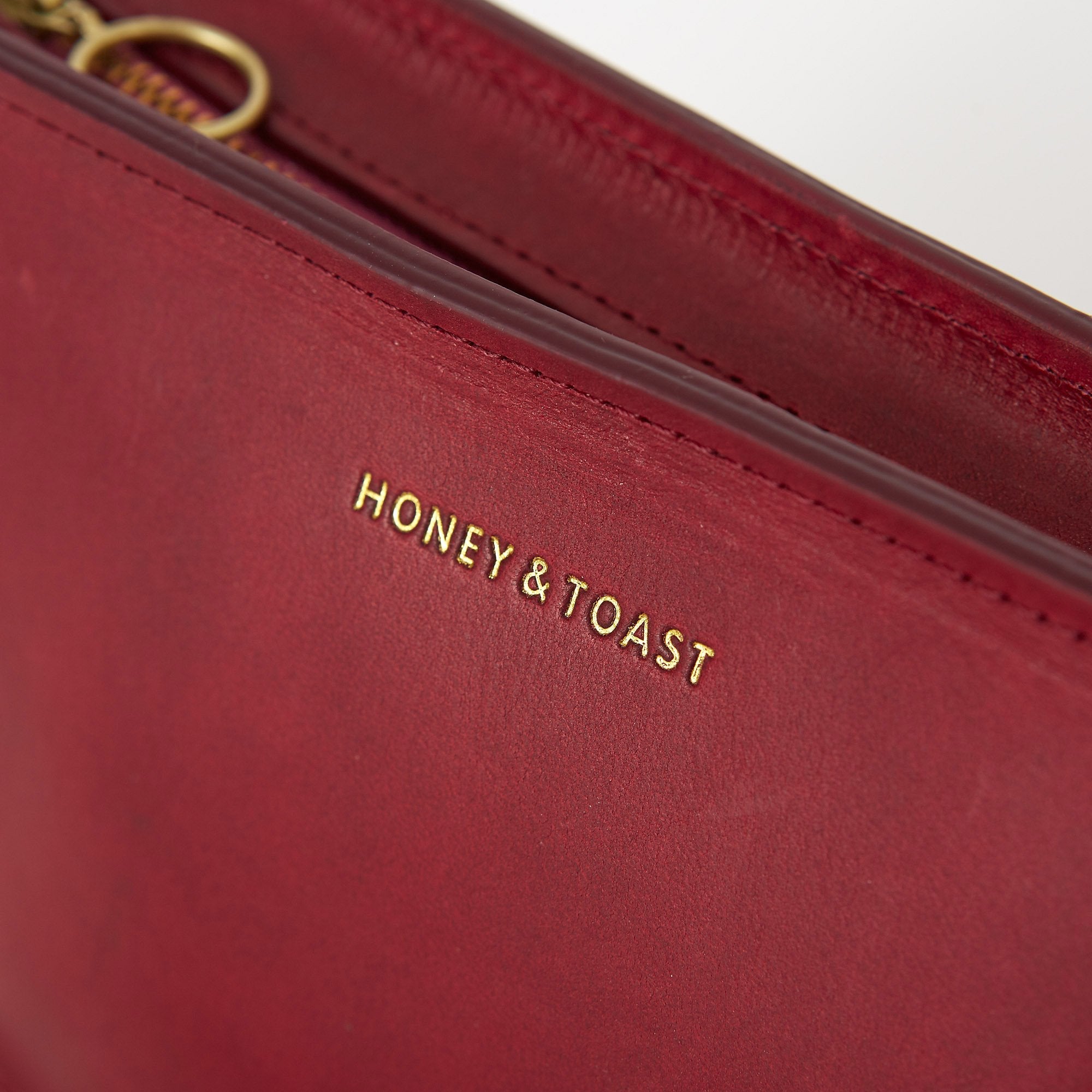 https://www.honeyandtoast.co.uk Half moon bag raspberry pink