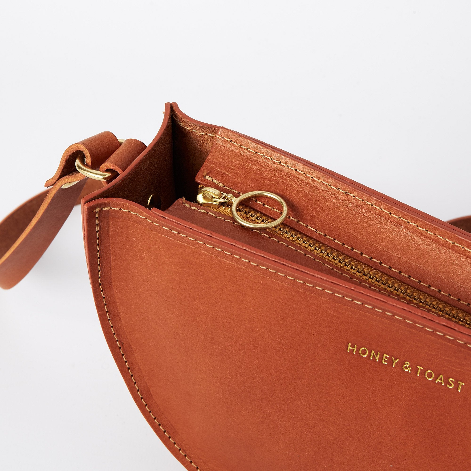 https://www.honeyandtoast.co.uk Half moon bag tan