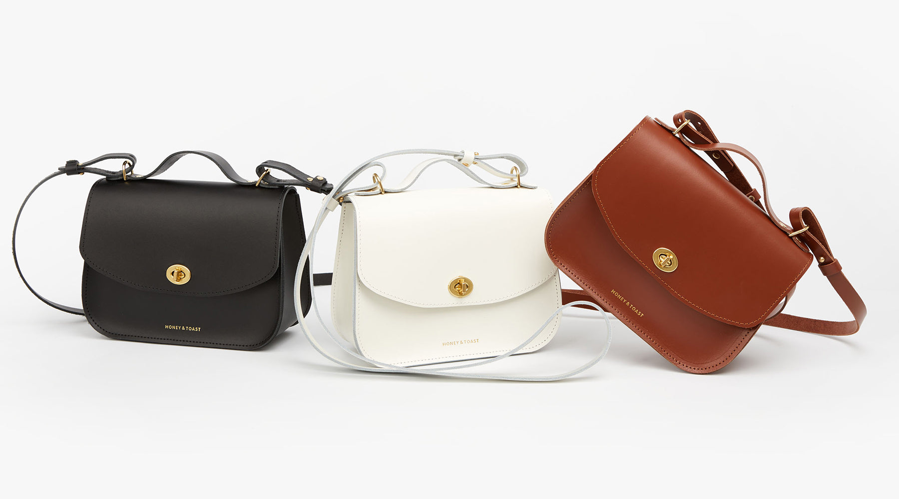Honey and Toast leather satchel bag in black, white and tan