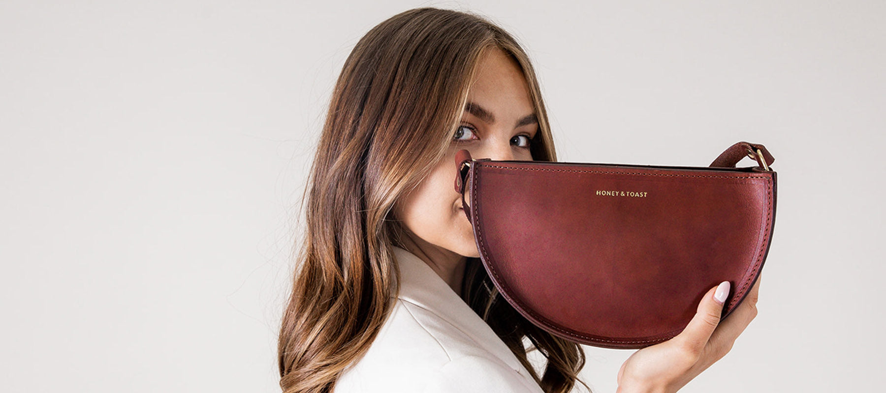 Honey and Toast leather crossbody half moon leather handbag