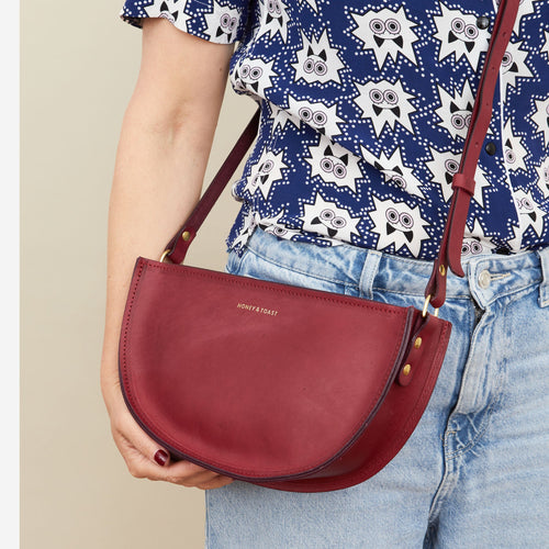 Honey and Toast women's leather handbag Large half moon bag raspberry