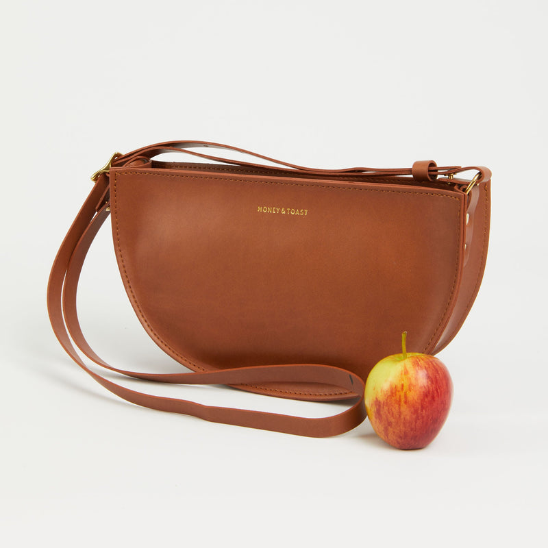 https://www.honeyandtoast.co.uk women's leather handbag Large apple leather half moon bag tan
