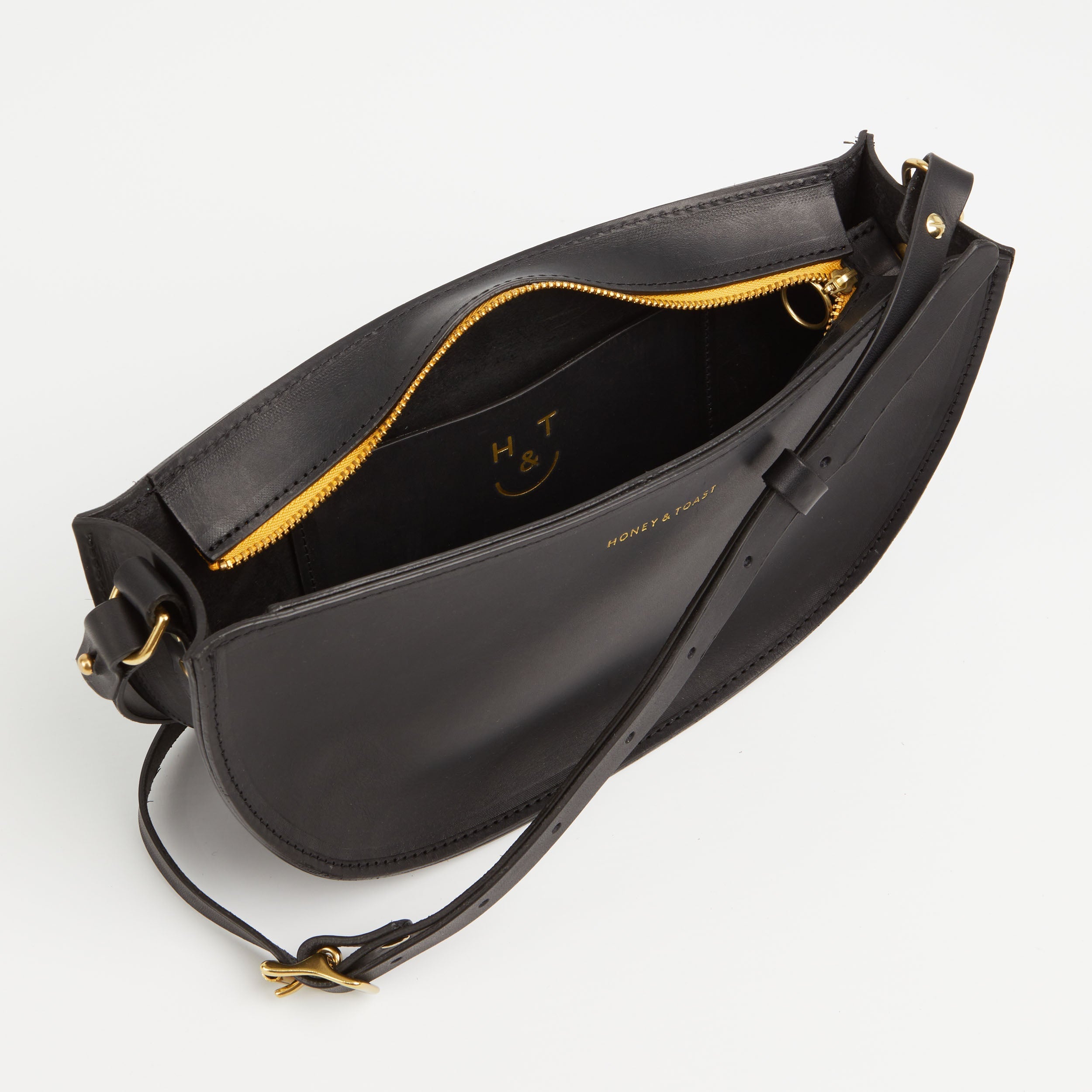 https://www.honeyandtoast.co.uk women's leather handbag Large half moon bag black