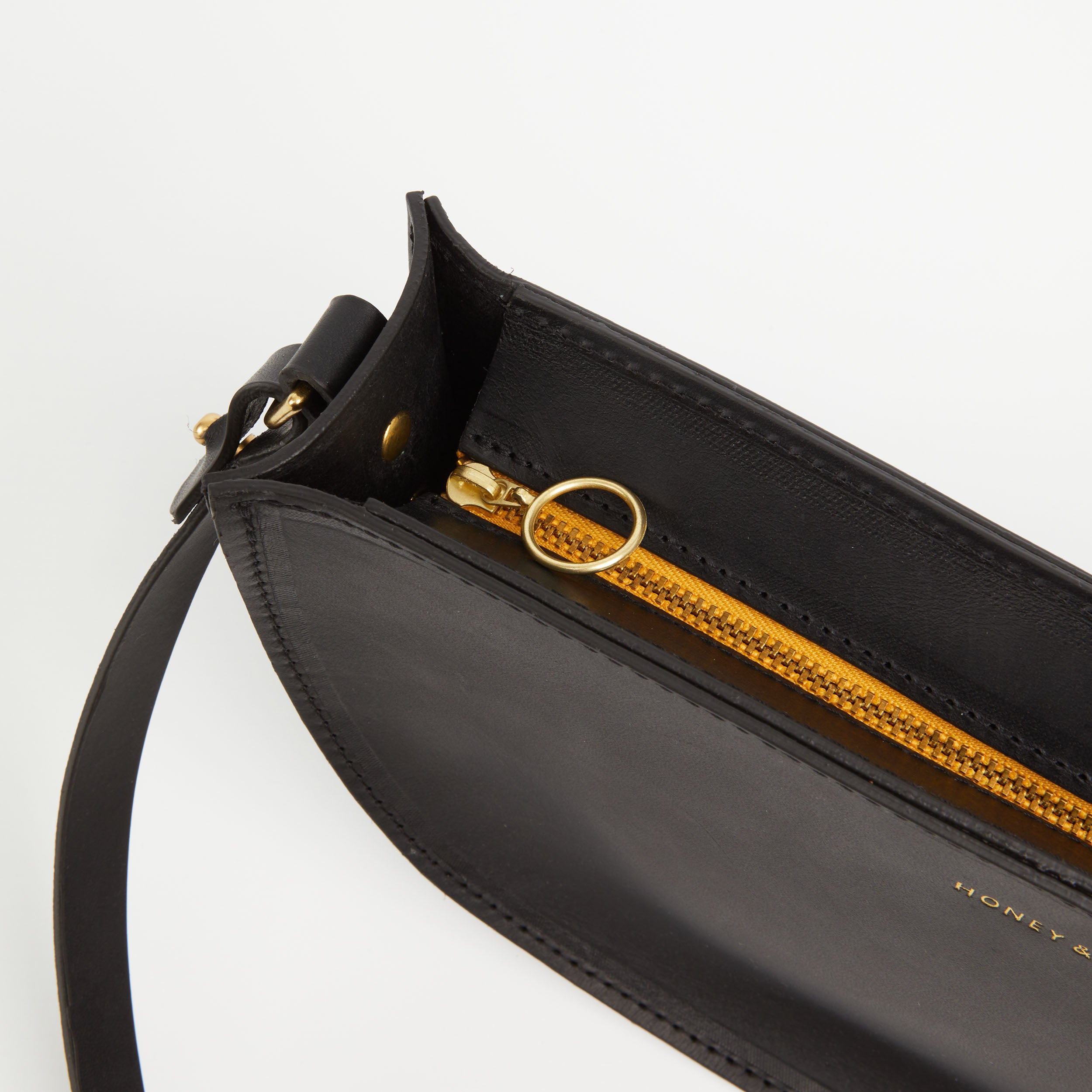 https://www.honeyandtoast.co.uk women's leather handbag Large half moon bag black