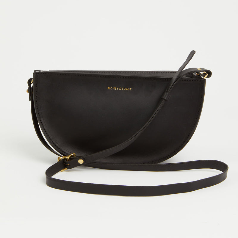 https://www.honeyandtoast.co.uk women's leather handbag Large half moon bag black