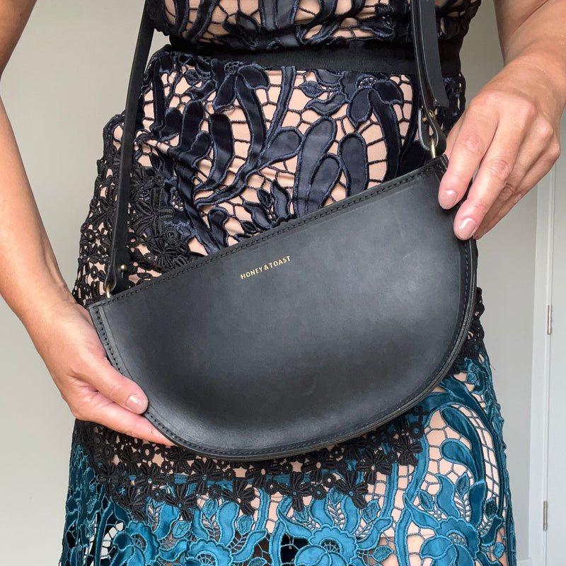 https://www.honeyandtoast.co.uk women's leather handbag Large half moon bag black