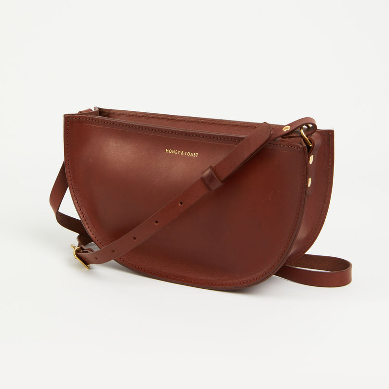https://www.honeyandtoast.co.uk women's leather handbag Large half moon bag conker