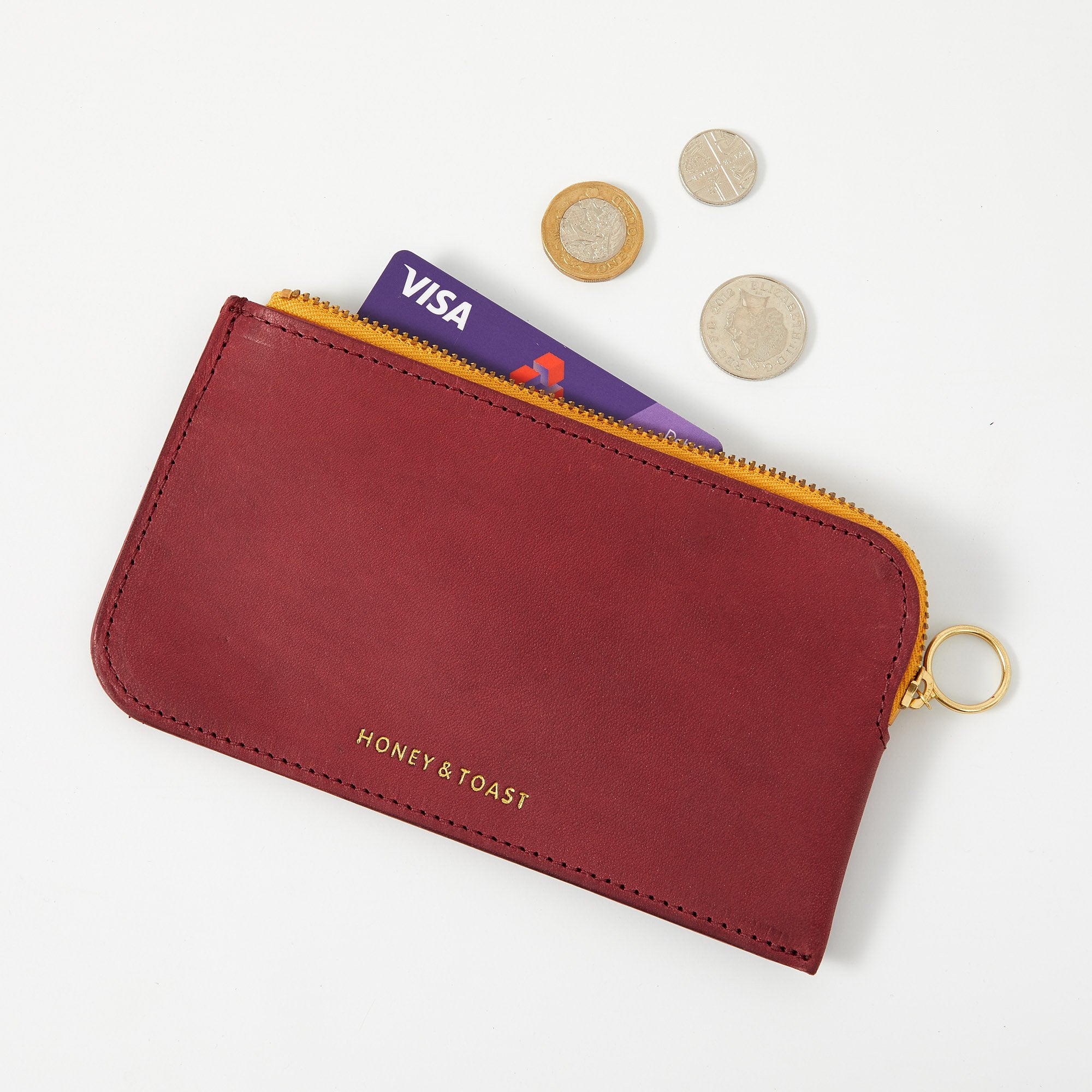 https://www.honeyandtoast.co.uk Bella zip around purse raspberry pink