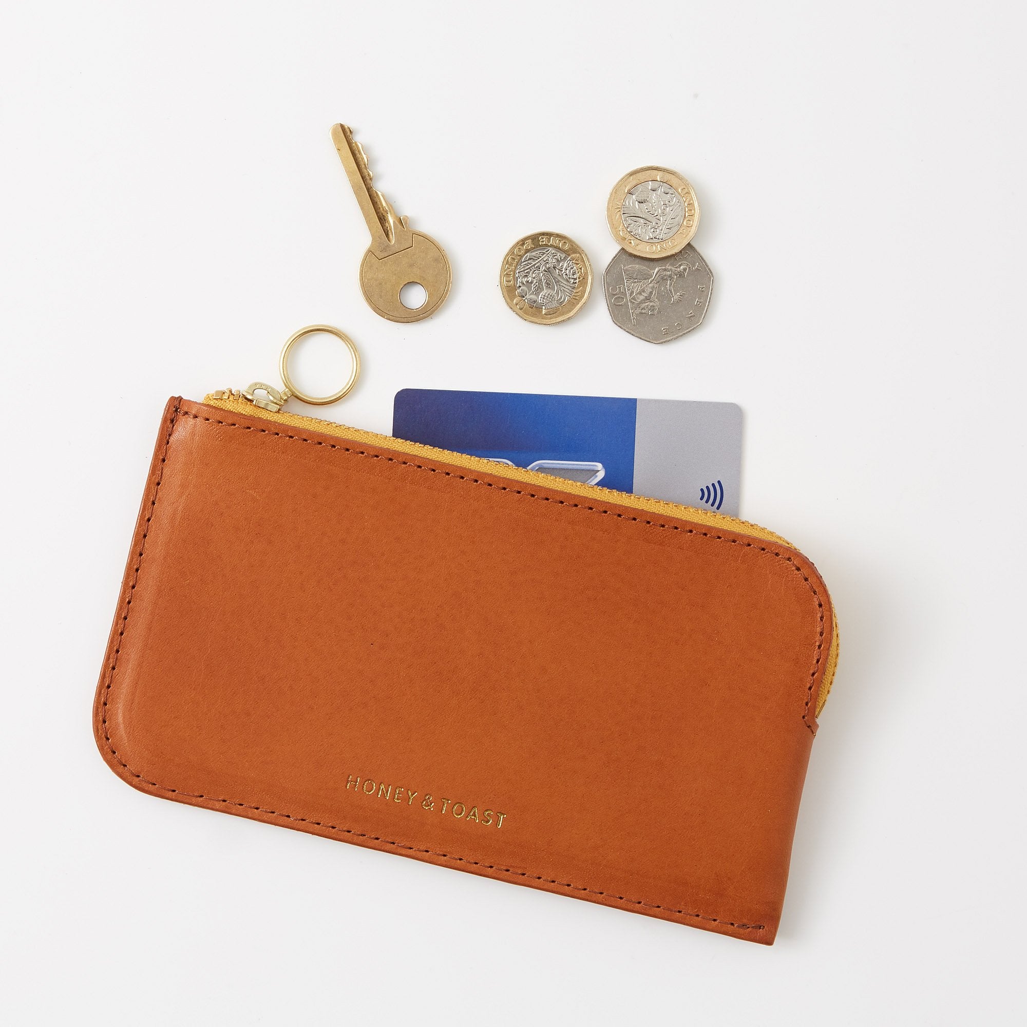 https://www.honeyandtoast.co.uk Bella zip around purse tan