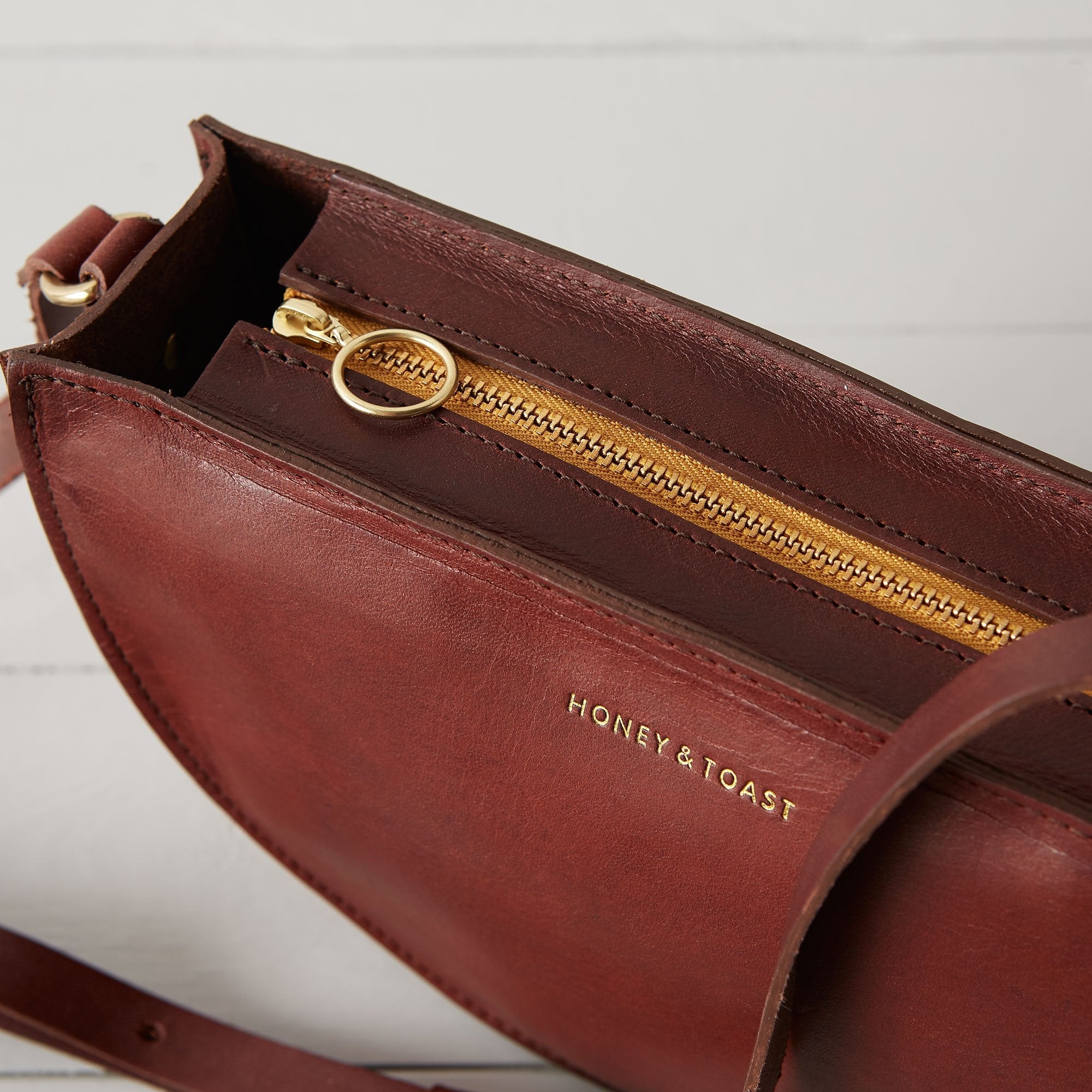 https://www.honeyandtoast.co.uk Half moon bag conker SAMPLE SALE