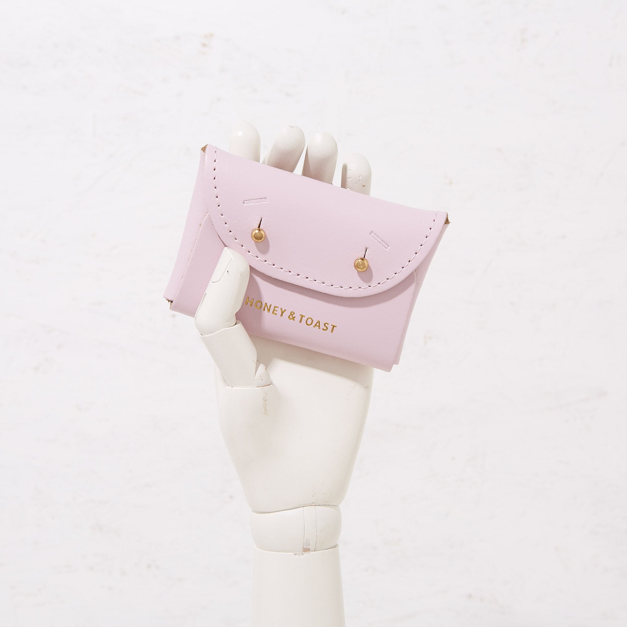 https://www.honeyandtoast.co.uk Jester card holder calamine pink