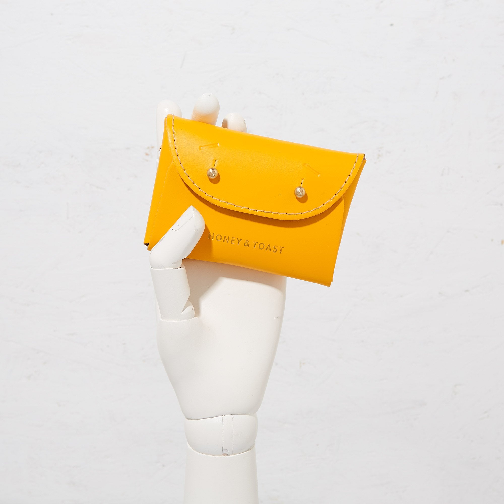 https://www.honeyandtoast.co.uk Jester card holder sun yellow