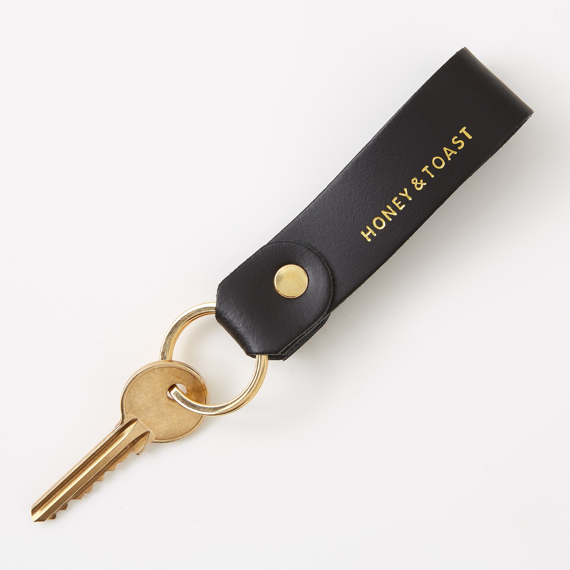 https://www.honeyandtoast.co.uk Leather loop keyring black