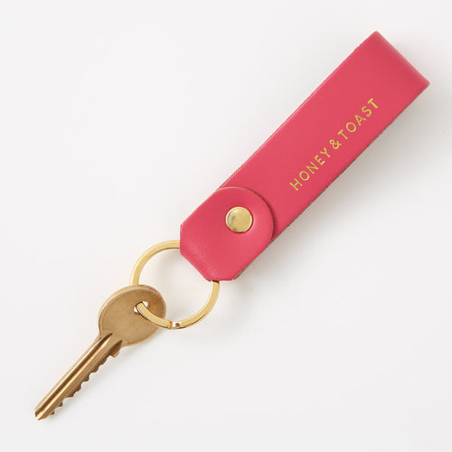 https://www.honeyandtoast.co.uk Leather loop keyring bright pink