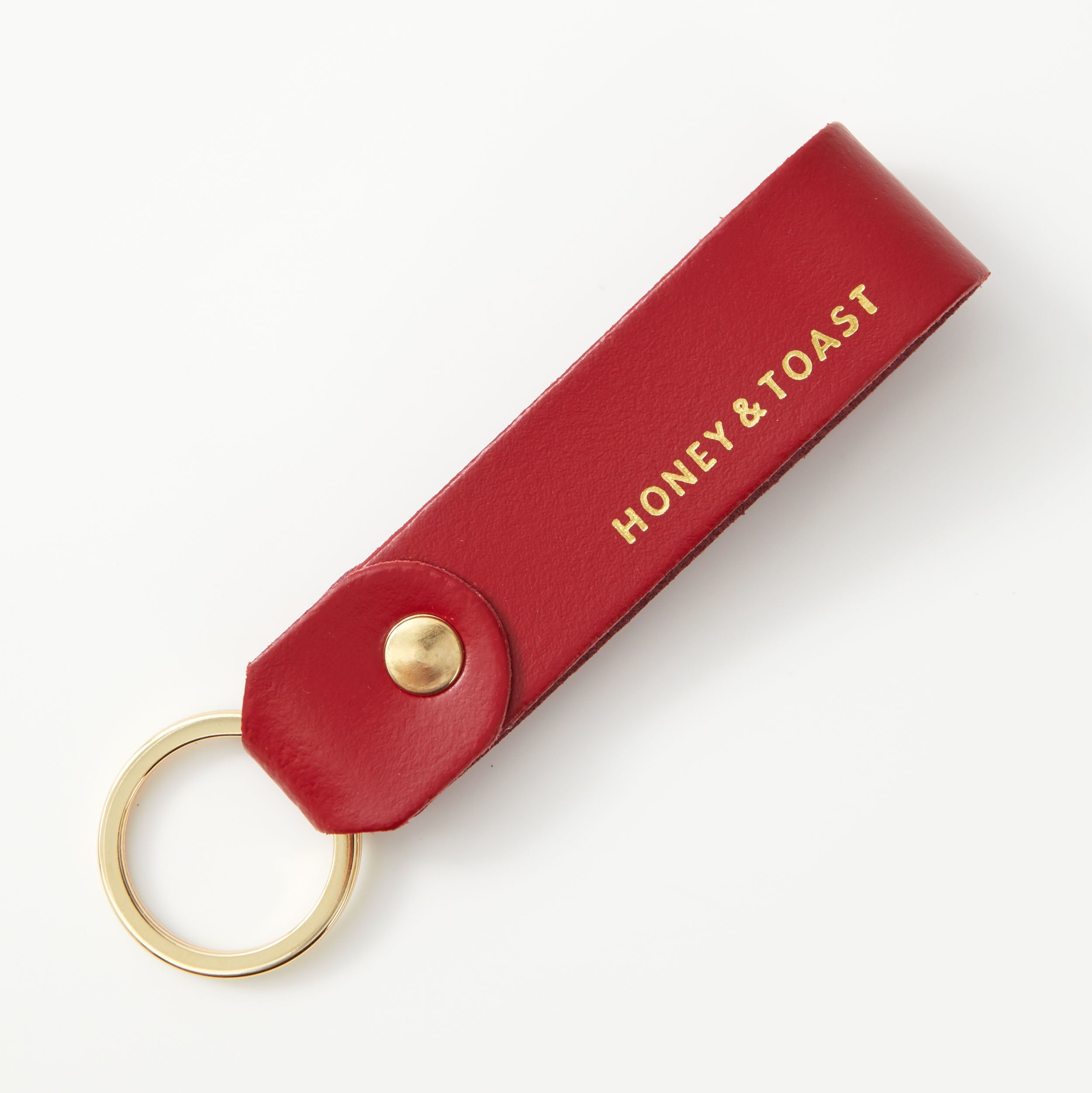https://www.honeyandtoast.co.uk Leather loop keyring red