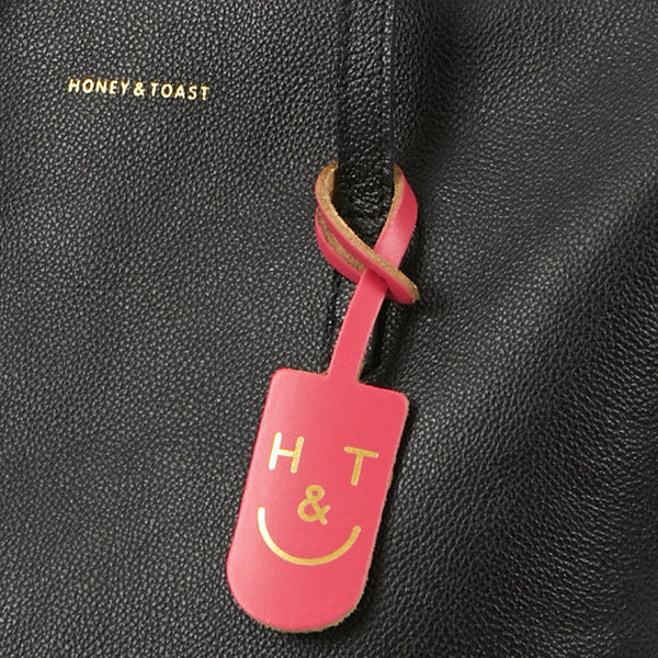 https://www.honeyandtoast.co.uk Leather tag Leather H&T tag pink