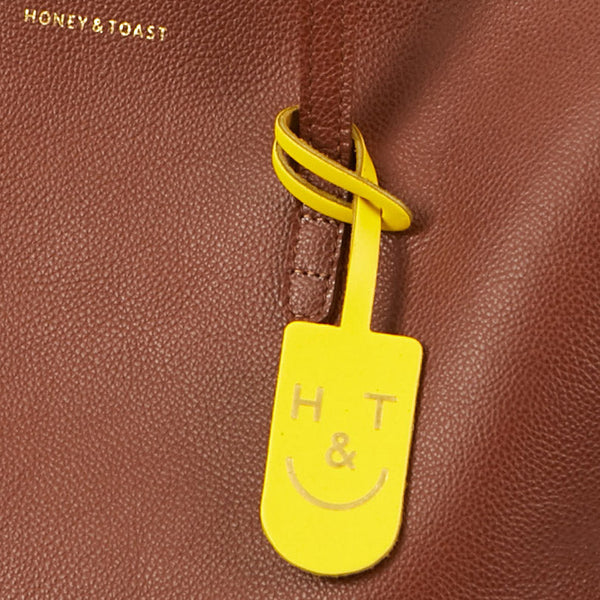 https://www.honeyandtoast.co.uk Leather tag Leather H&T tag yellow