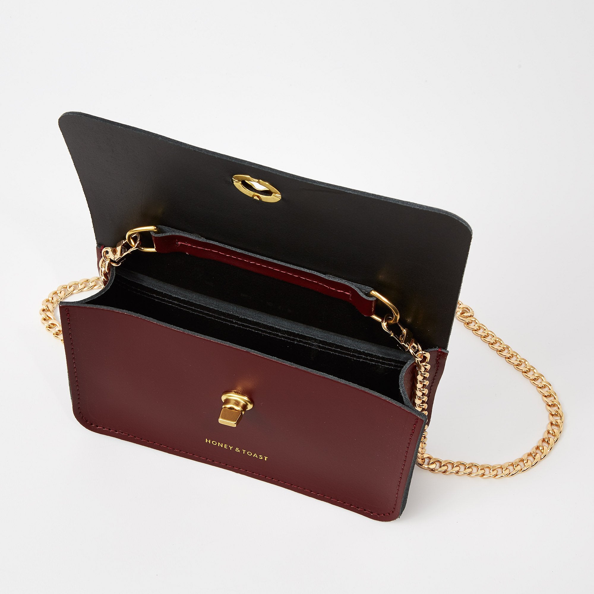 https://www.honeyandtoast.co.uk Mini Eddie shoulder bag damson