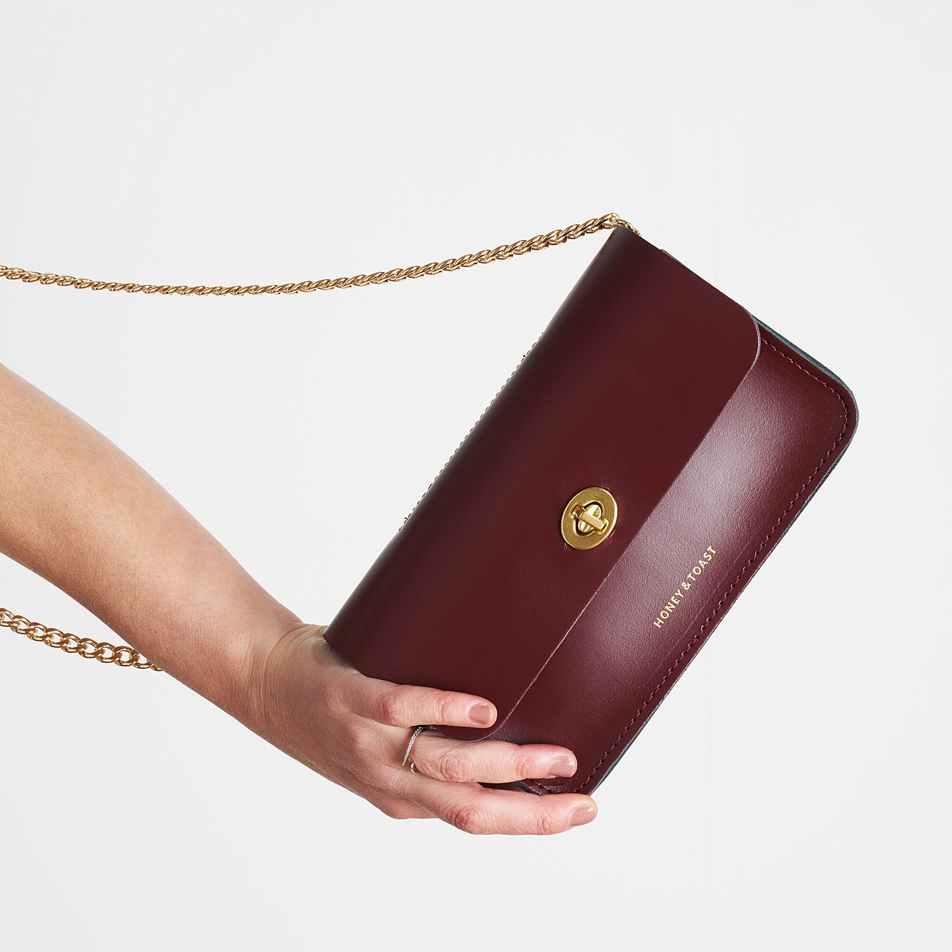 https://www.honeyandtoast.co.uk Mini Eddie shoulder bag damson