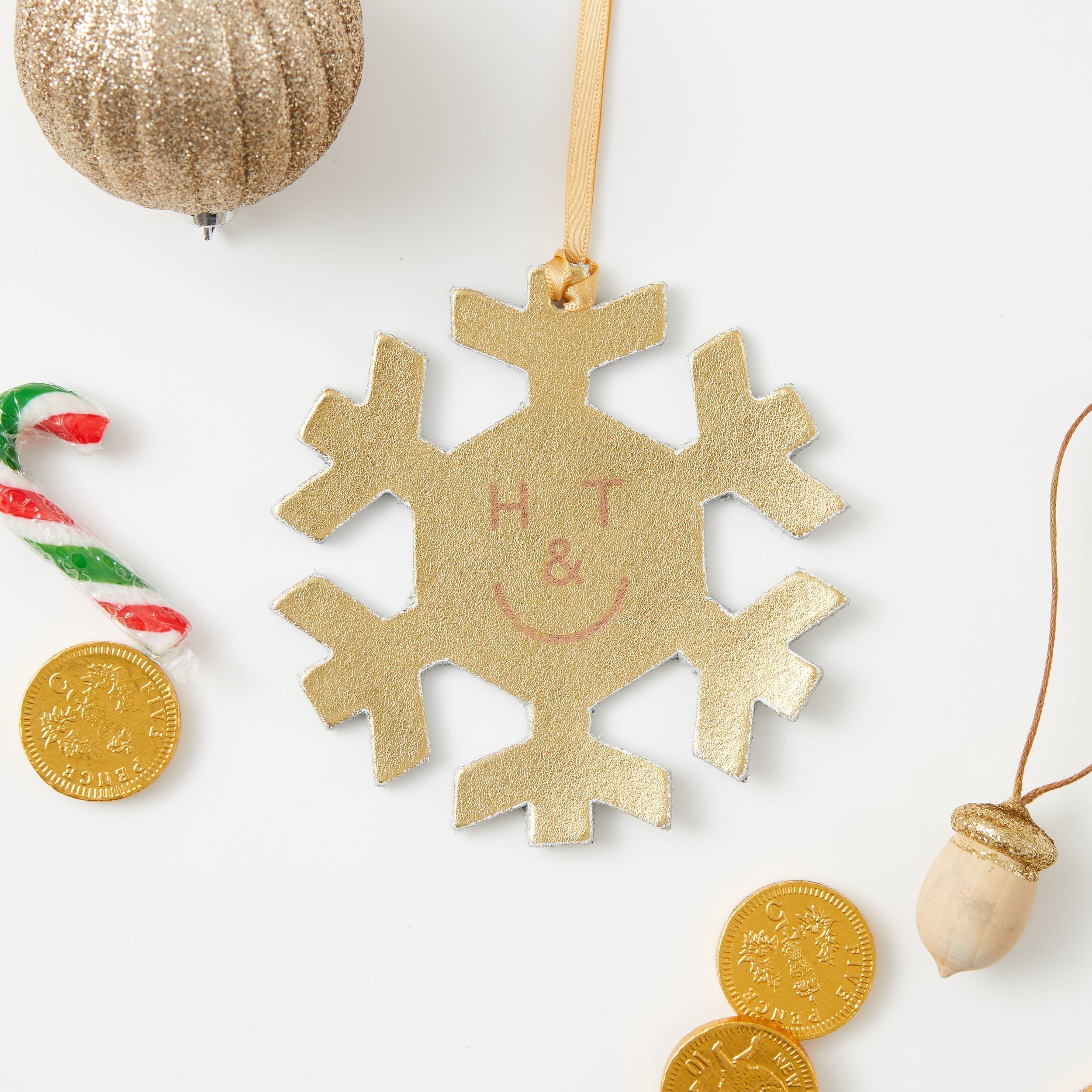 https://www.honeyandtoast.co.uk Snowflake hanging decoration gold