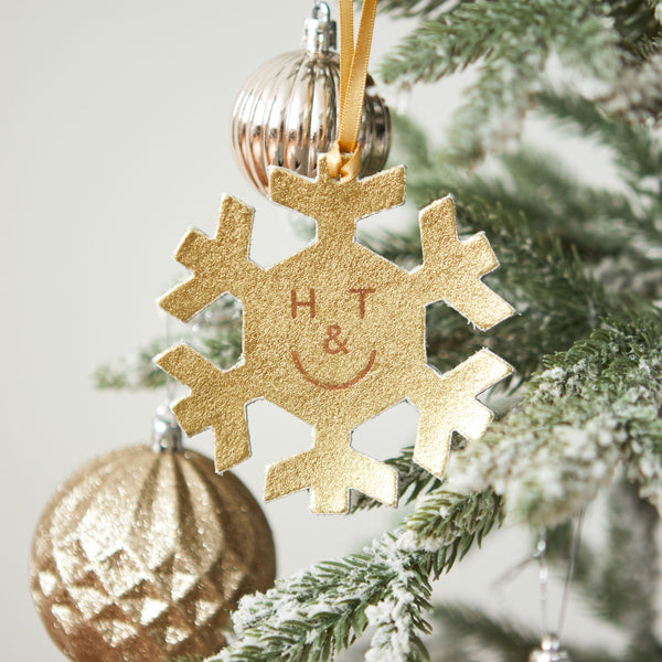 https://www.honeyandtoast.co.uk Snowflake hanging decoration gold