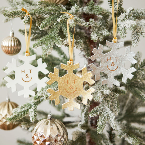 https://www.honeyandtoast.co.uk Snowflake hanging decoration gold