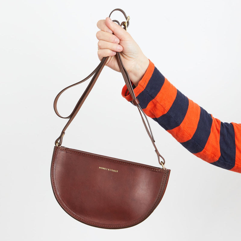 https://www.honeyandtoast.co.uk women's leather handbag Half moon bag conker