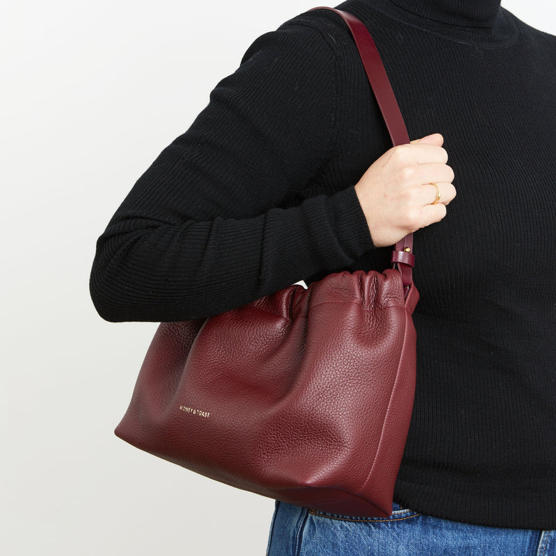 https://www.honeyandtoast.co.uk women's leather handbag Jamie cinch shoulder bag damson